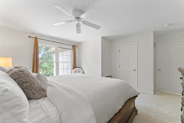 a bathroom with a double vanity sink mirror and toilet