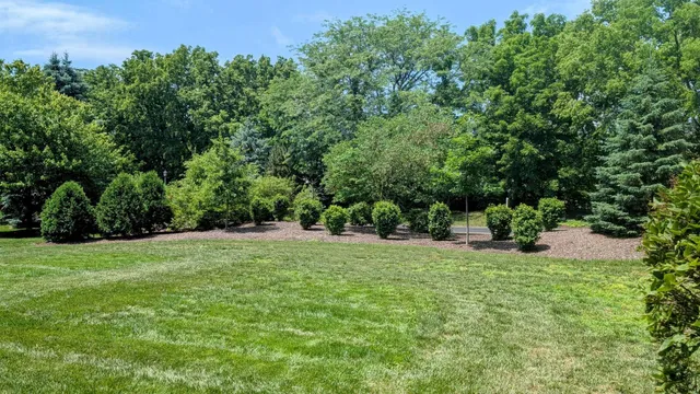 an aerial view of a house with a garden