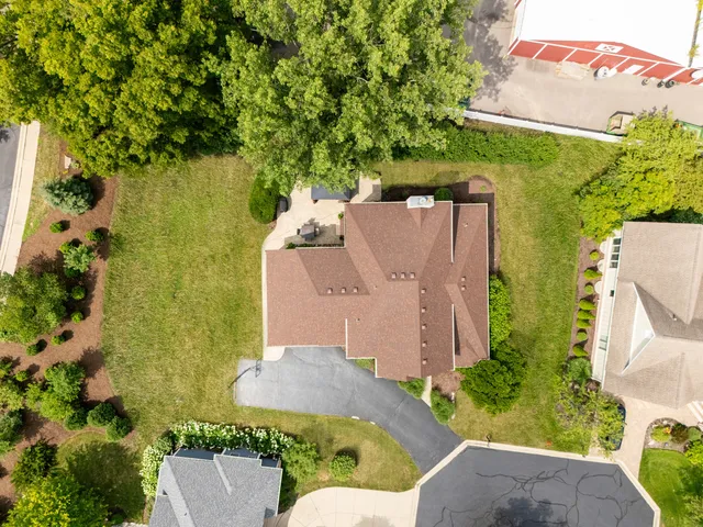 an aerial view of residential house with outdoor space and swimming pool