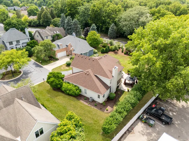 an aerial view of residential house with outdoor space and street view