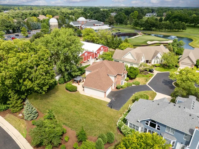 an aerial view of a house with a garden
