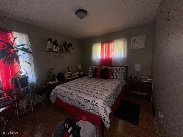 9717 Alexander Road Cleveland, OH 44125 - Photo 7 of 13 Bedroom featuring a textured ceiling and wood finished floors