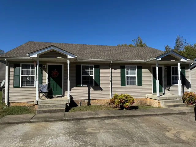 a front view of a house with a porch