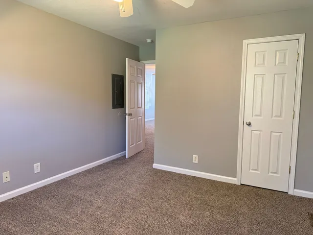 an empty room with closet area