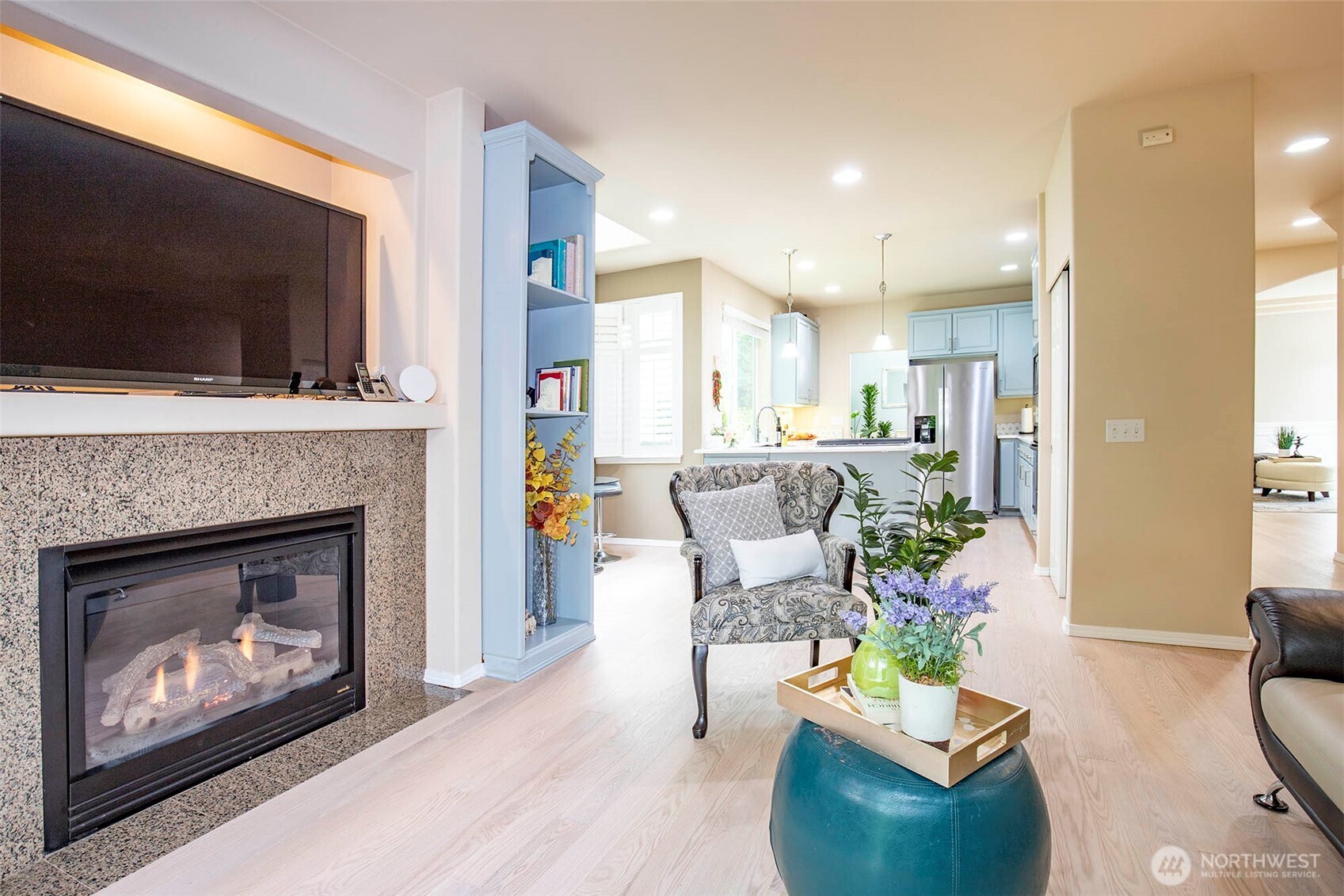 19 198th Place Southeast Bothell, WA 98012 - Photo 11 of 33 a living room with furniture a flat screen tv and a fireplace