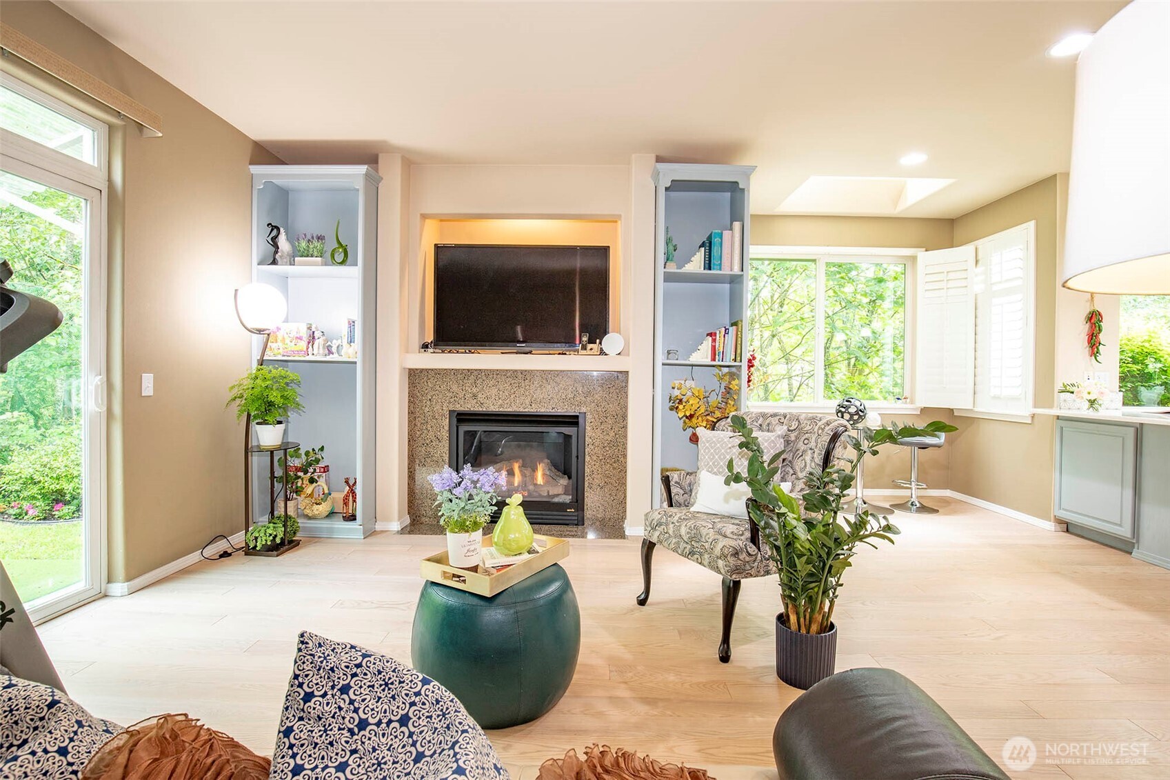 19 198th Place Southeast Bothell, WA 98012 - Photo 13 of 33 a living room with furniture a flat screen tv and a fireplace