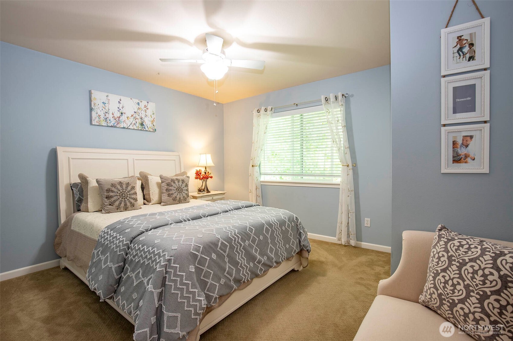 19 198th Place Southeast Bothell, WA 98012 - Photo 21 of 33 a bedroom with a large bed and a chandelier