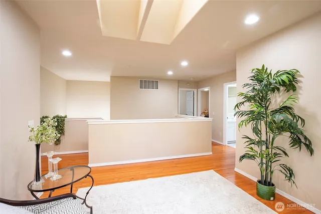 a view of a room with furniture and a potted plant