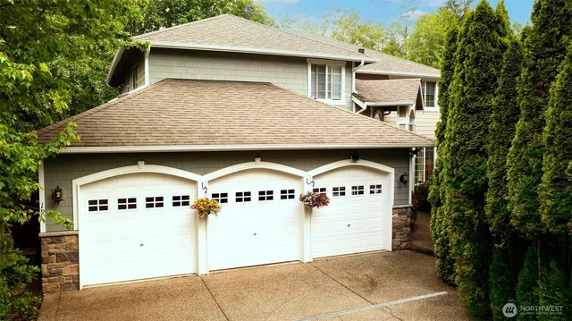 a front view of a house with garage
