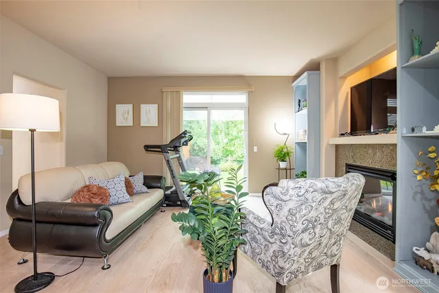 a living room with furniture and a fireplace