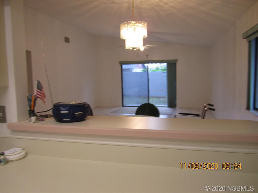 511 Cardinal Drive Edgewater, FL 32141 - Photo 7 of 13 a bathroom with a sink and a mirror