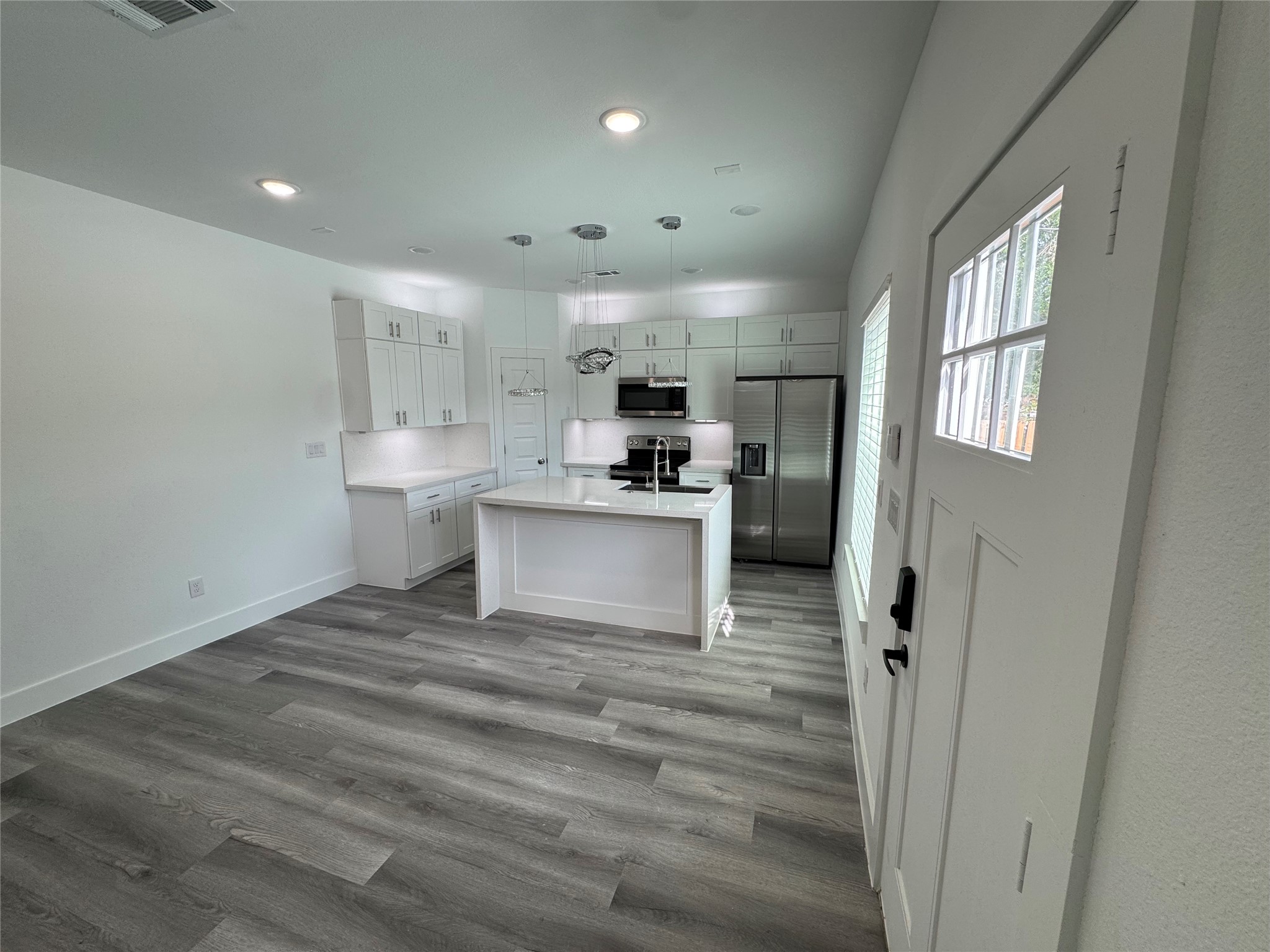 4604 Bricker Street, Unit A Houston, TX 77051 - Photo 3 of 15 a view of a kitchen with a sink cabinets and window