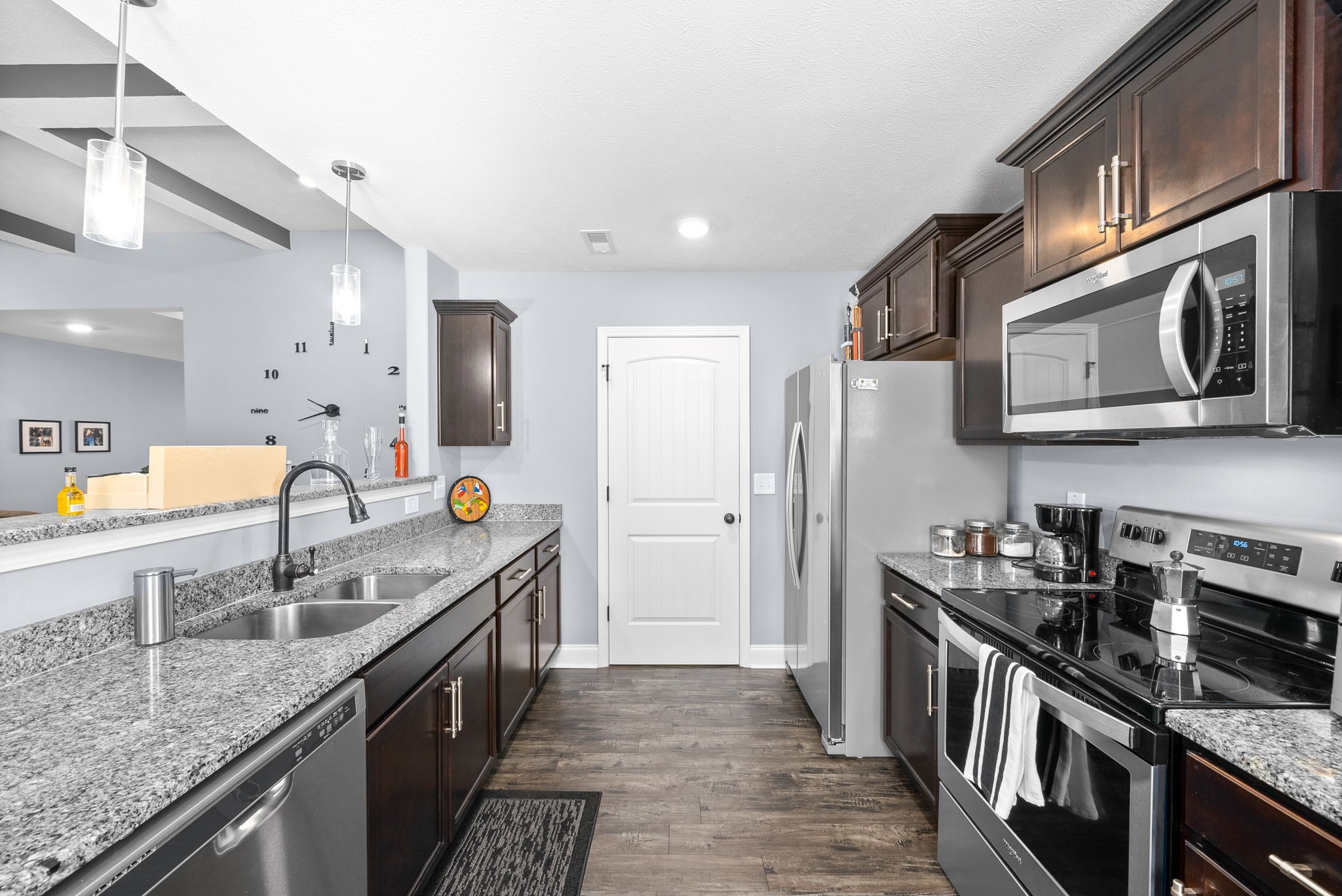 1807 Rains Road Clarksville, TN 37042 - Photo 12 of 39 a kitchen with stainless steel appliances granite countertop a sink stove and refrigerator