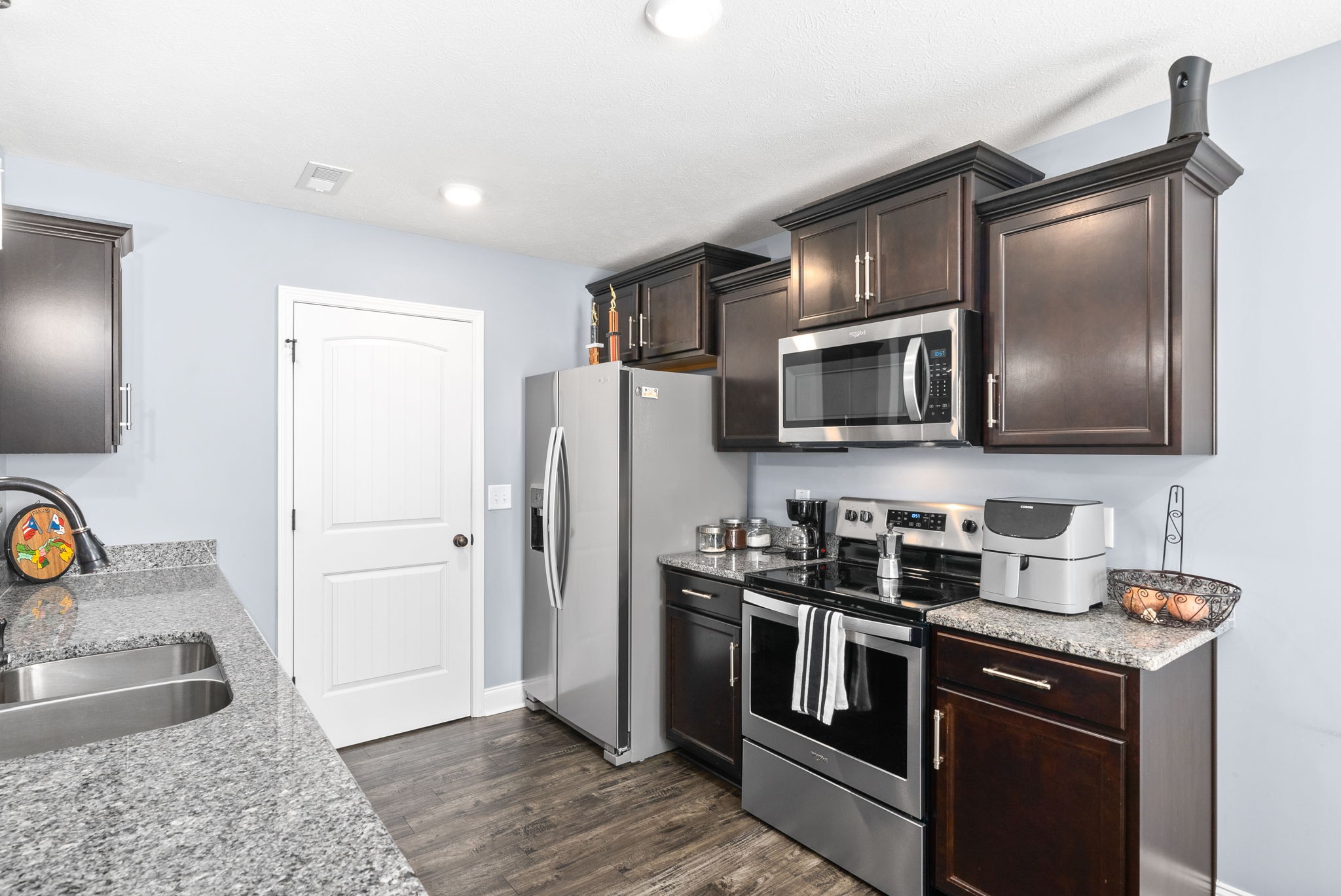 1807 Rains Road Clarksville, TN 37042 - Photo 13 of 39 a kitchen with stainless steel appliances granite countertop a refrigerator and a sink