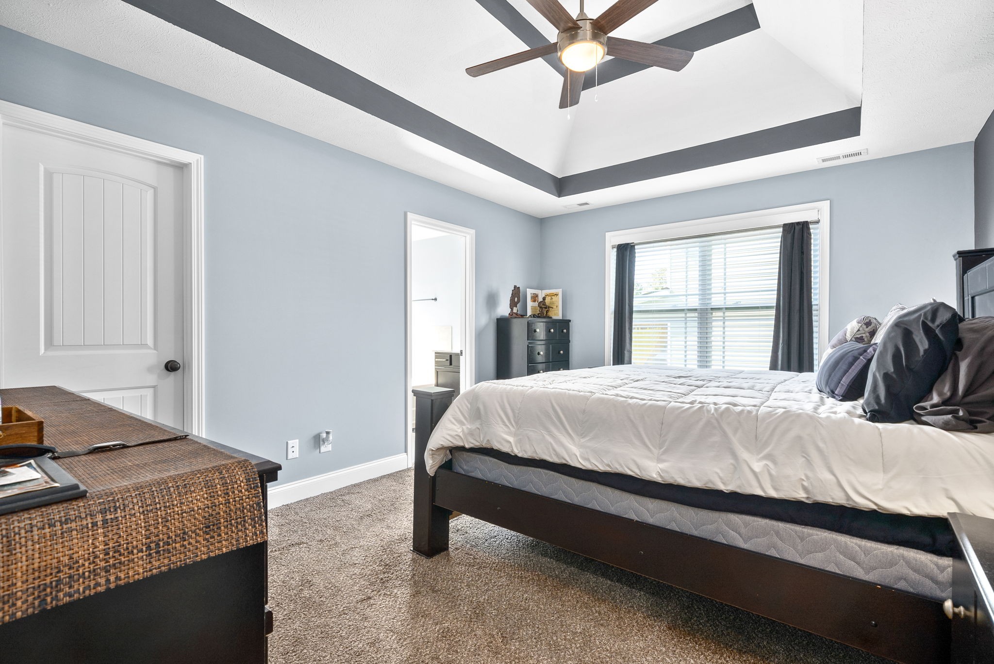 1807 Rains Road Clarksville, TN 37042 - Photo 17 of 39 a bed sitting in a spacious bedroom next to a window