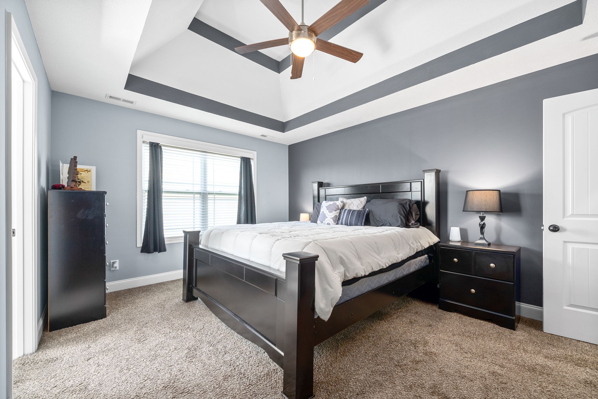 1807 Rains Road Clarksville, TN 37042 - Photo 18 of 39 a bedroom with a bed and a chandelier