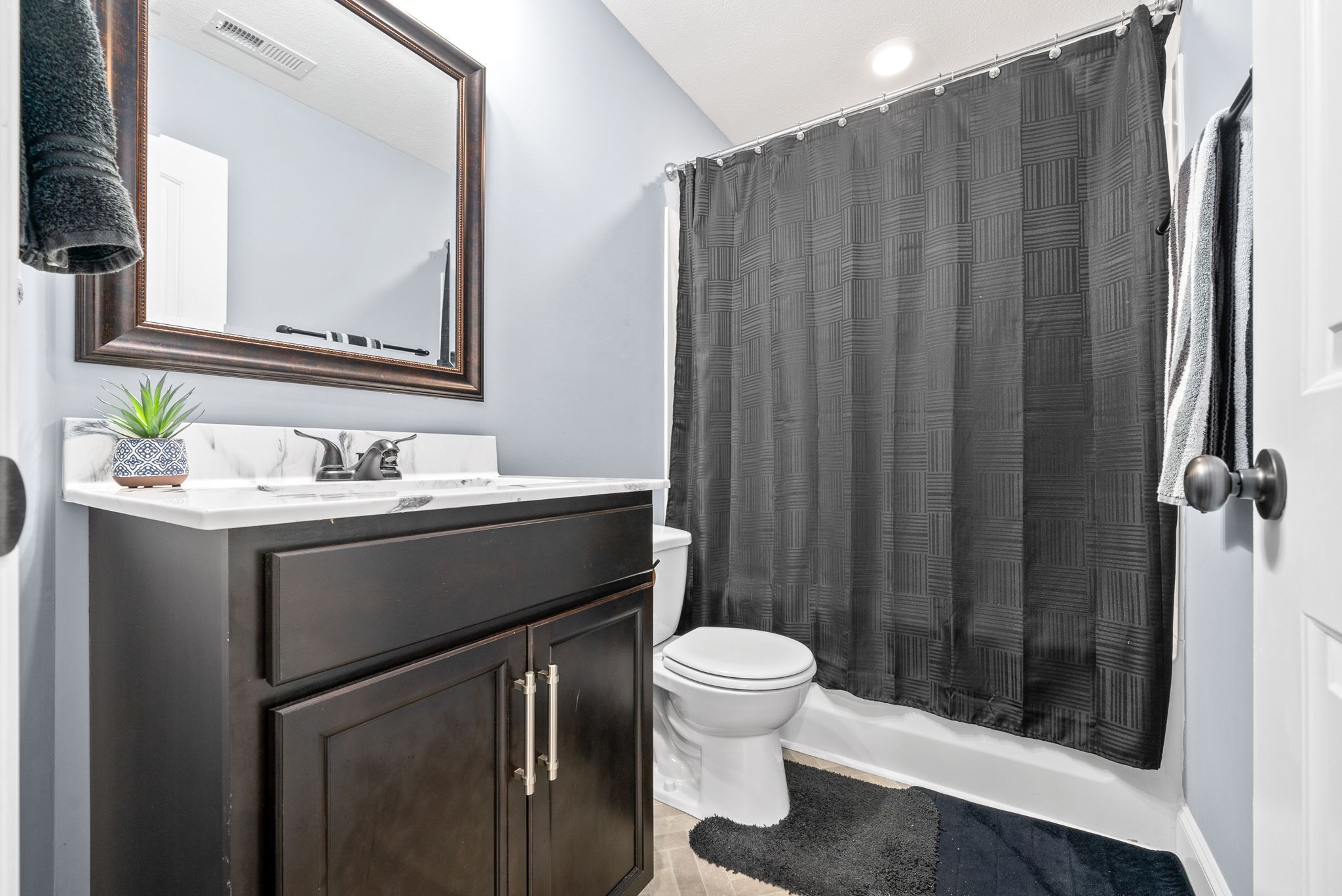 1807 Rains Road Clarksville, TN 37042 - Photo 23 of 39 a bathroom with a sink a toilet and shower