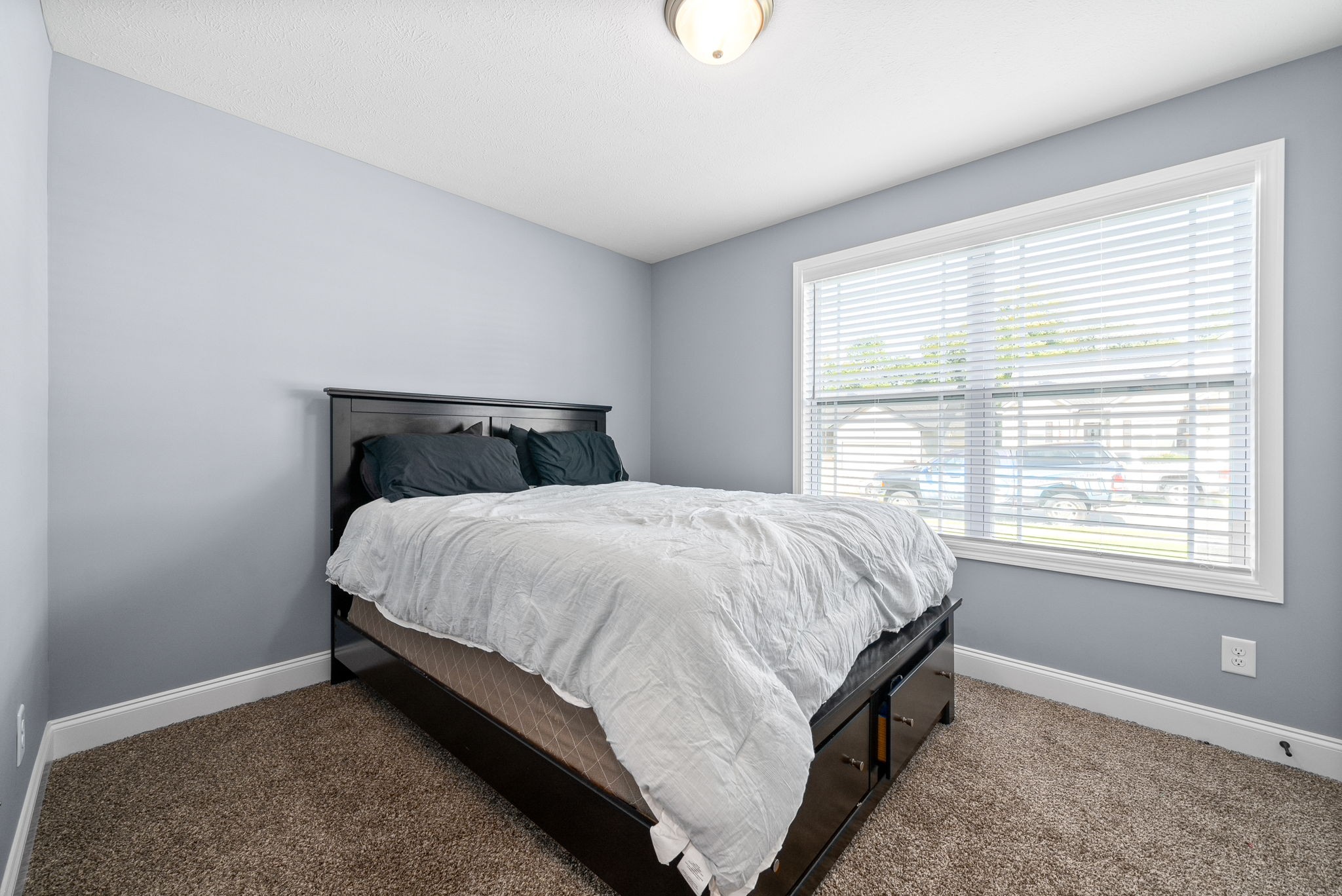 1807 Rains Road Clarksville, TN 37042 - Photo 24 of 39 a bed sitting in a bedroom next to a window