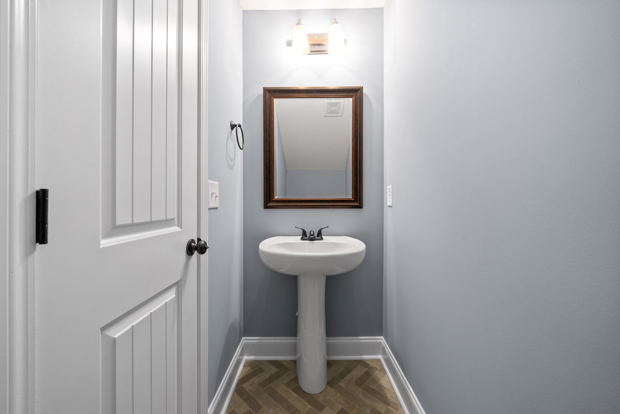 1807 Rains Road Clarksville, TN 37042 - Photo 27 of 39 a bathroom with a sink a mirror and a toilet