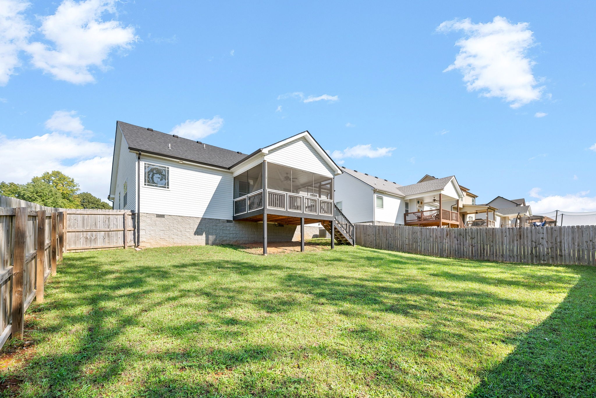 1807 Rains Road Clarksville, TN 37042 - Photo 32 of 39 a view of a house with a big yard and a large tree