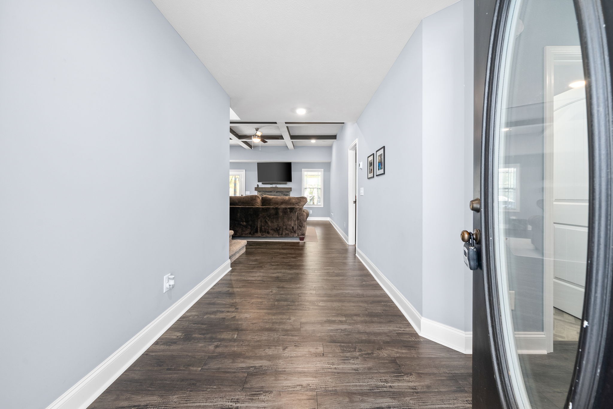 1807 Rains Road Clarksville, TN 37042 - Photo 5 of 39 a view of a hallway with wooden floor and staircase