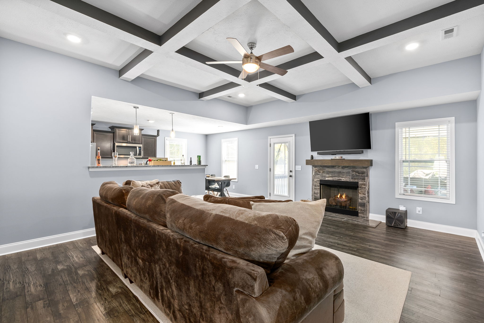 1807 Rains Road Clarksville, TN 37042 - Photo 6 of 39 a living room with furniture a fireplace and a flat screen tv