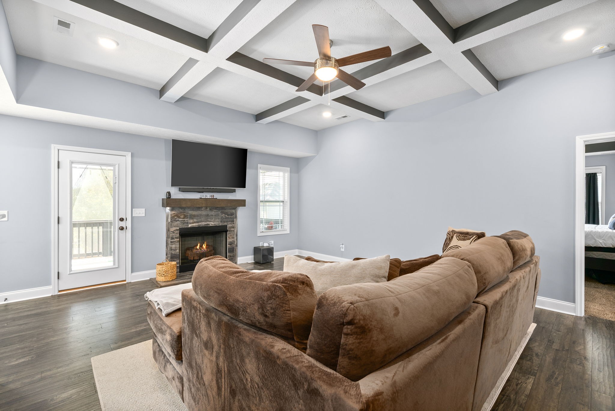 1807 Rains Road Clarksville, TN 37042 - Photo 8 of 39 a living room with furniture a flat screen tv and a fireplace
