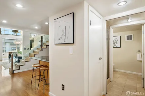 a view of a livingroom with furniture and wooden floor