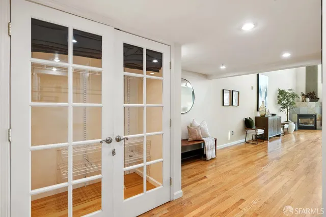 a living room with furniture window and wooden floor