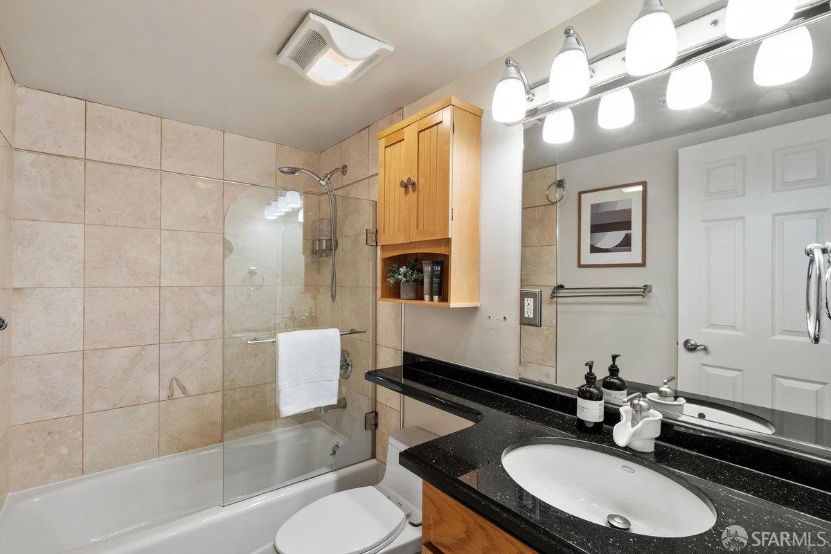 1578 Indiana Street, Unit 8 San Francisco, CA 94107 - Photo 23 of 36 a bathroom with a sink double vanity a toilet a mirror and shower