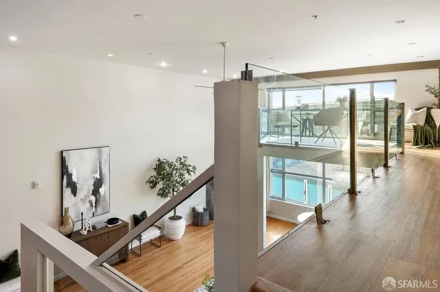 a view of an entryway with wooden floor