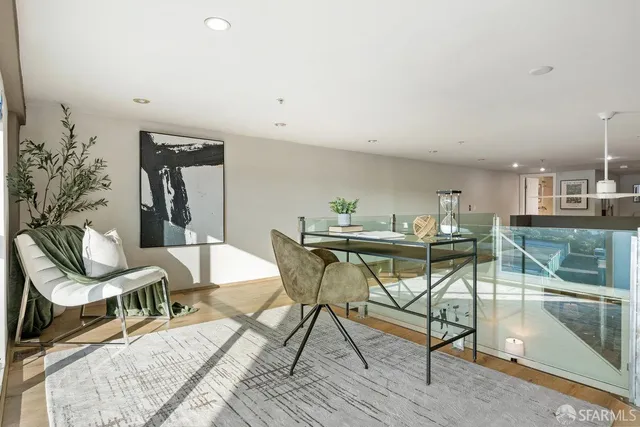 a workspace with furniture and wooden floor