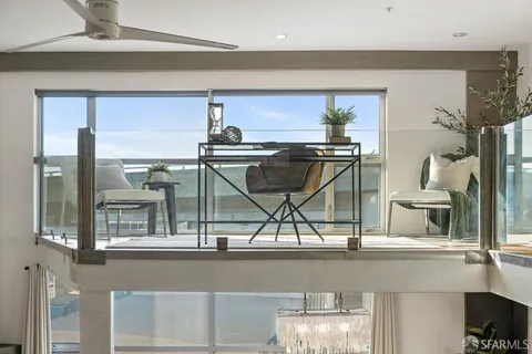 a view of a kitchen with a sink and cabinets
