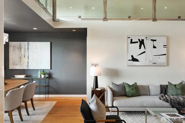 a living room with furniture and a lamp