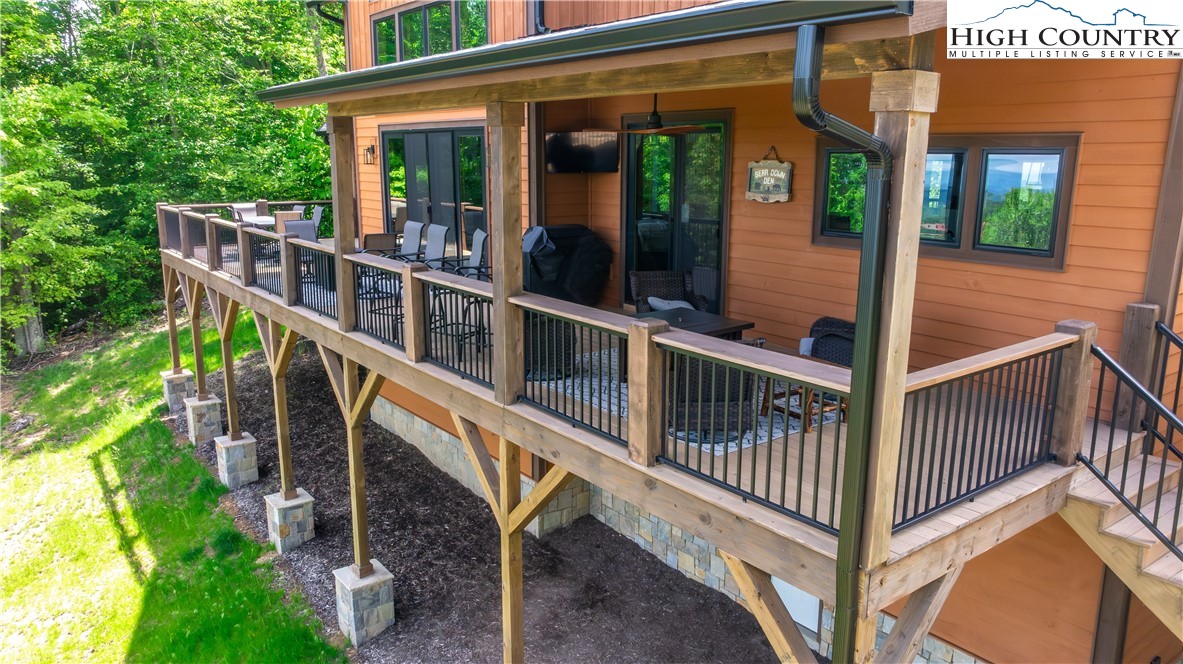 165 Eagle Pass Banner Elk, NC 28604 - Photo 12 of 41 a view of a house with porch and wooden fence