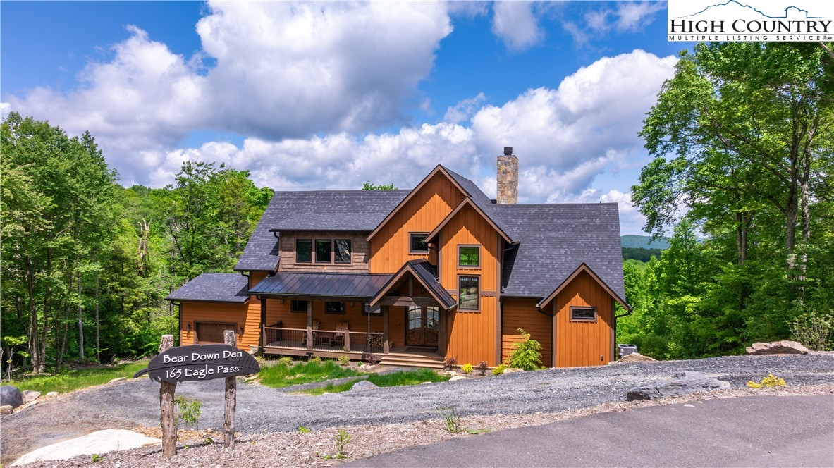 165 Eagle Pass Banner Elk, NC 28604 - Photo 2 of 41 a front view of a house with garden