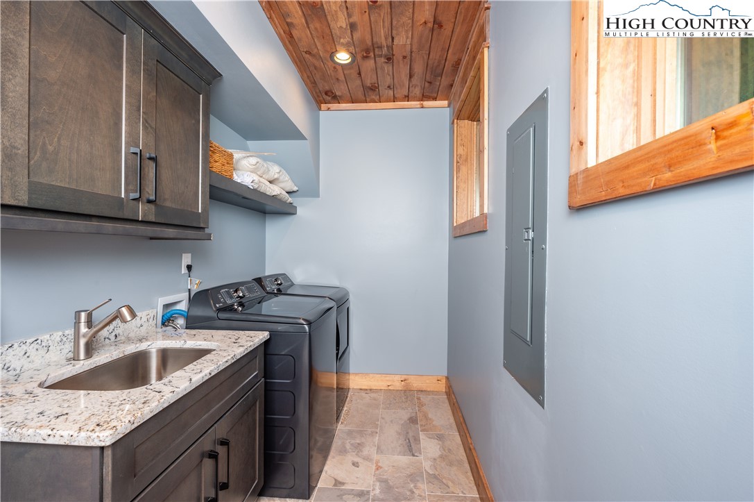 165 Eagle Pass Banner Elk, NC 28604 - Photo 22 of 41 a kitchen with stainless steel appliances granite countertop a sink stove and cabinets