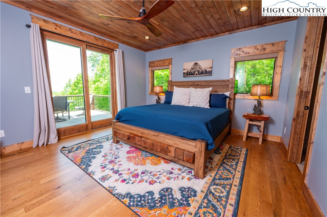 165 Eagle Pass Banner Elk, NC 28604 - Photo 24 of 41 a bed sitting in a bedroom next to a window