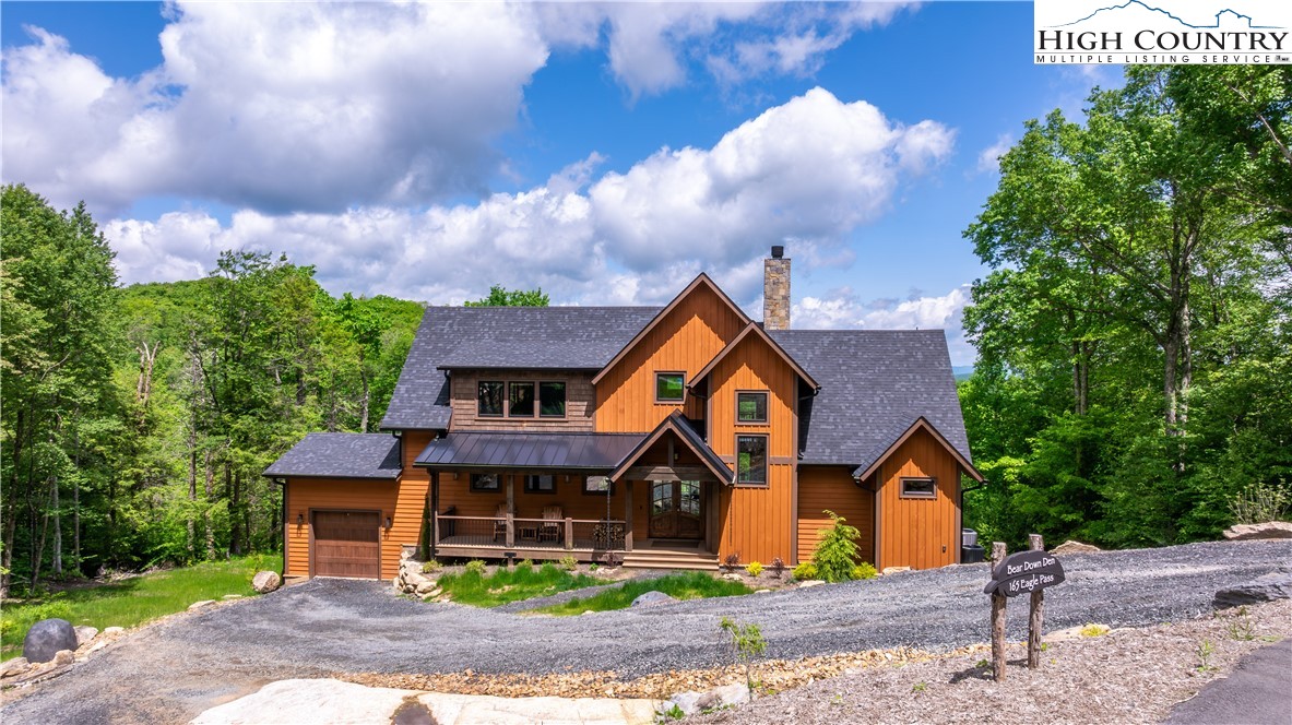 165 Eagle Pass Banner Elk, NC 28604 - Photo 3 of 41 a front view of a house with garden