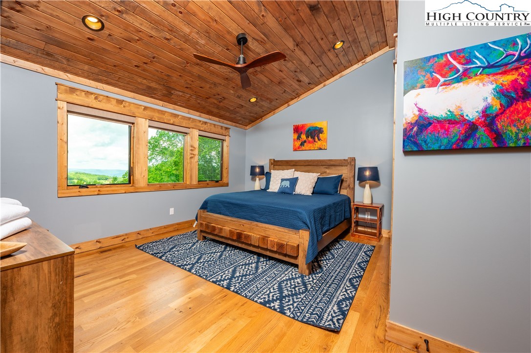 165 Eagle Pass Banner Elk, NC 28604 - Photo 31 of 41 a bedroom with a bed dresser and window
