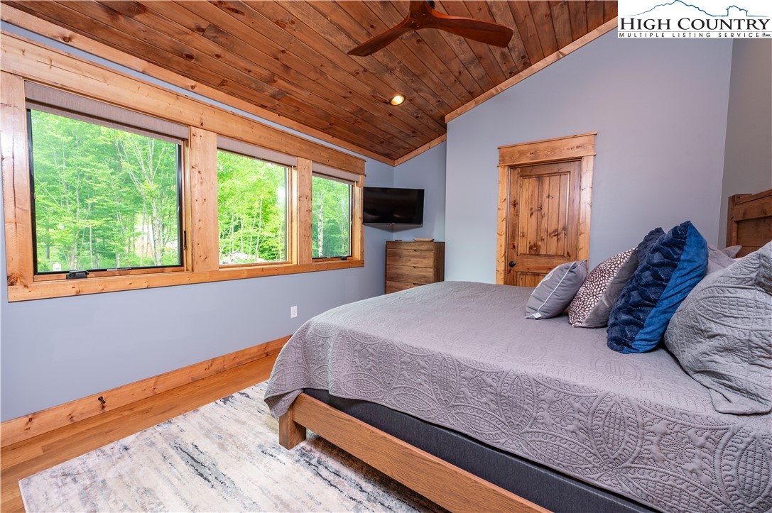 165 Eagle Pass Banner Elk, NC 28604 - Photo 33 of 41 a bedroom with a large bed and a tv