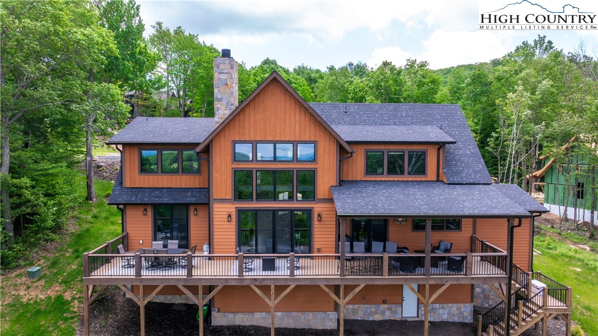 165 Eagle Pass Banner Elk, NC 28604 - Photo 6 of 41 a front view of a house with yard porch and furniture