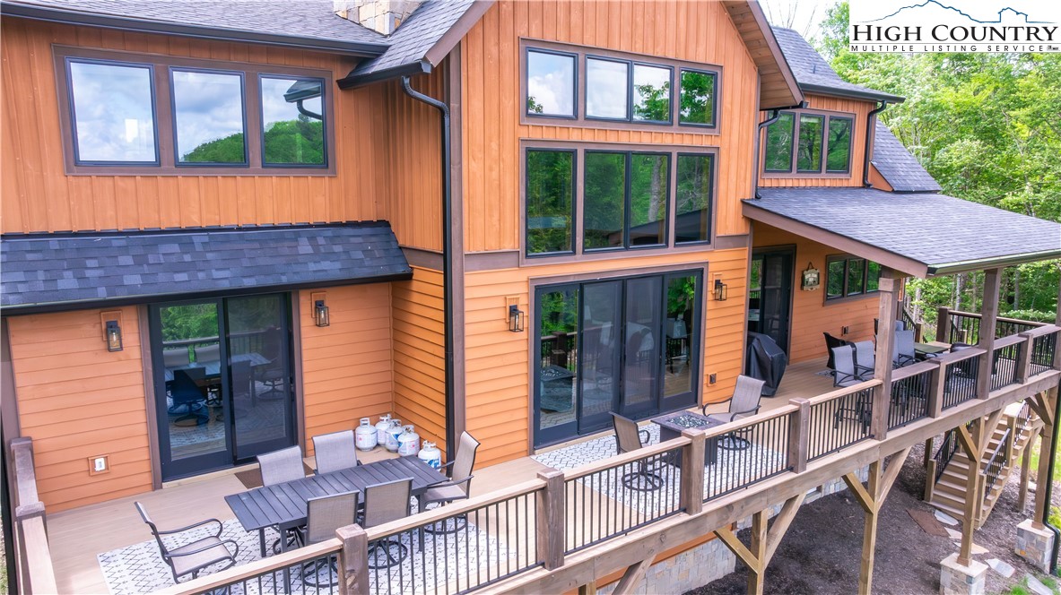 165 Eagle Pass Banner Elk, NC 28604 - Photo 7 of 41 a view of a house with a porch and furniture