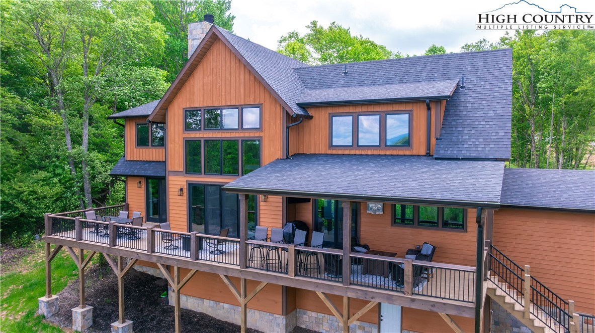 165 Eagle Pass Banner Elk, NC 28604 - Photo 8 of 41 a front view of a house with balcony and garden