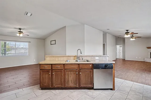 a kitchen with a sink and cabinets