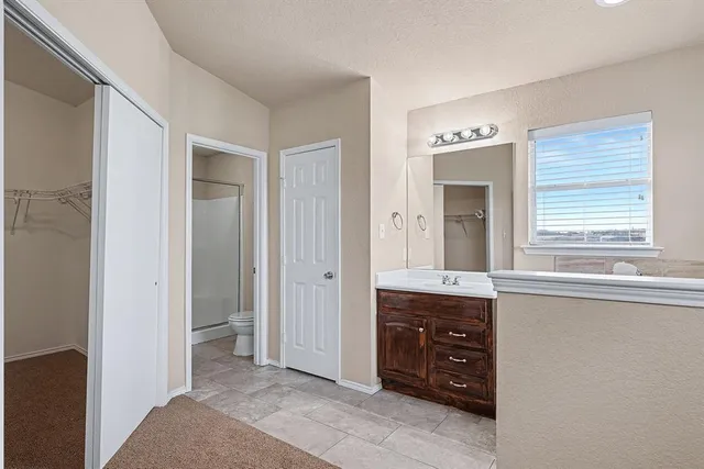 a room with a cabinets and a dresser