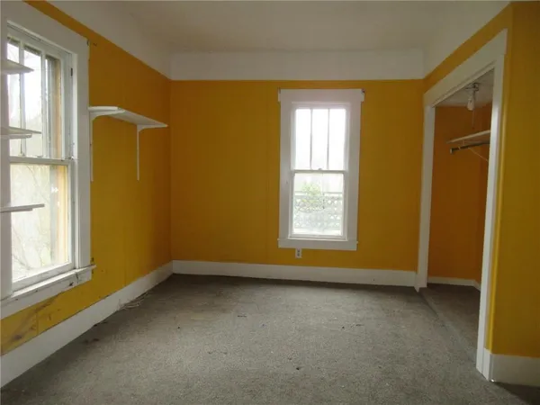 an empty room with windows