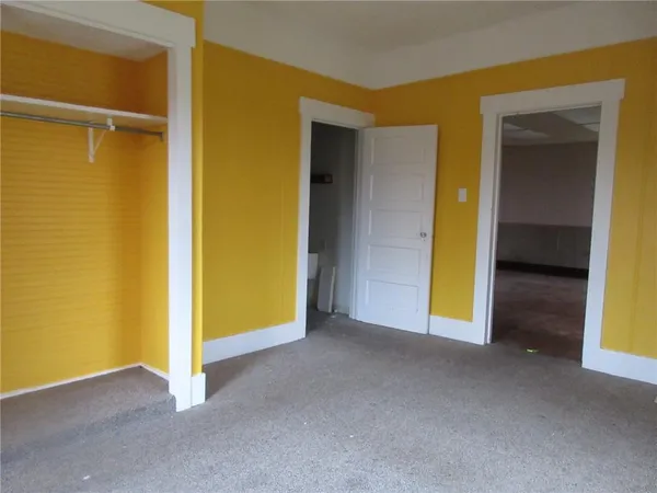 a view of an empty room with a gallery