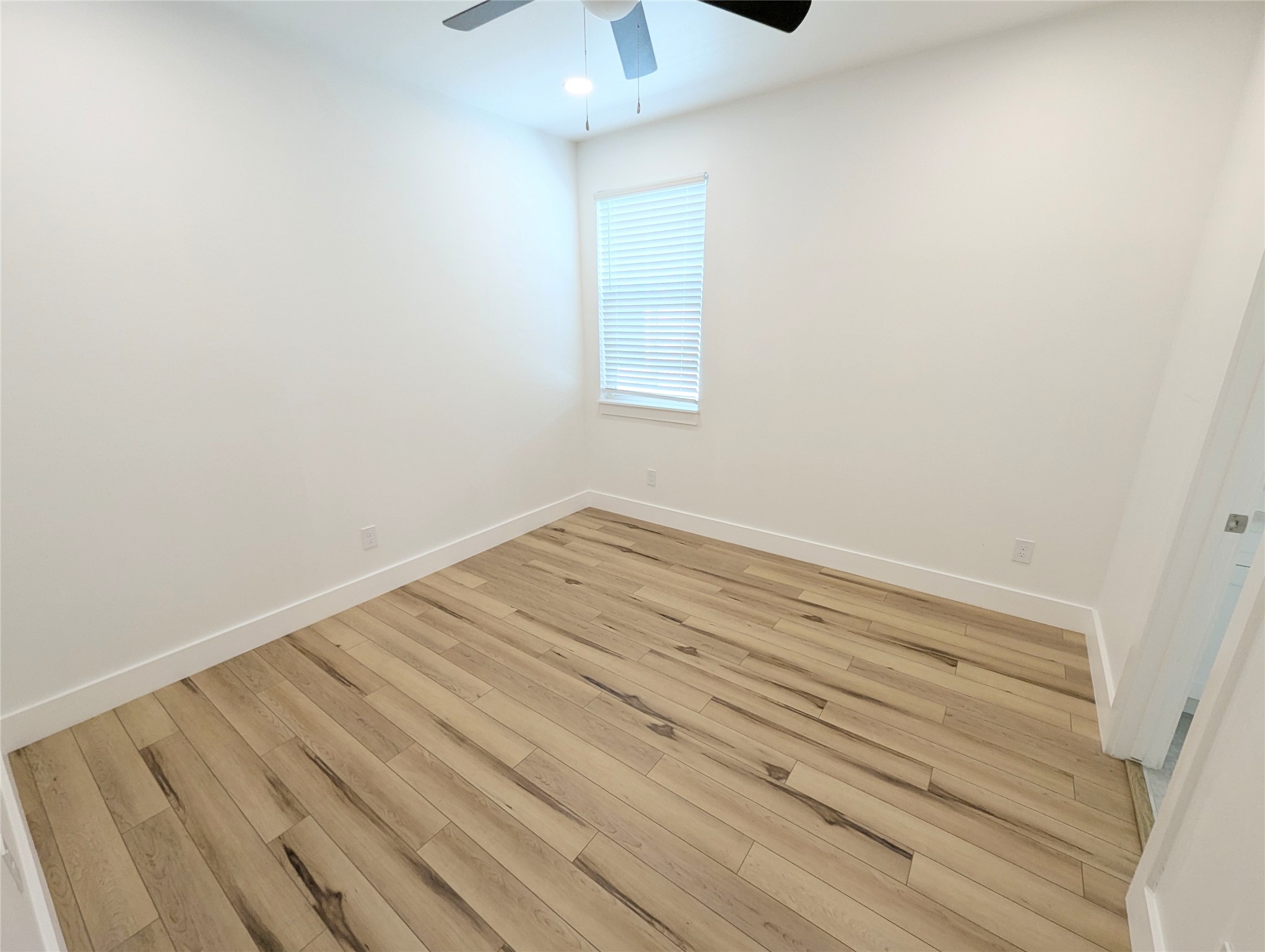 4913 Fisk Street Houston, TX 77009 - Photo 20 of 27 a view of a room with wooden floor and cabinet