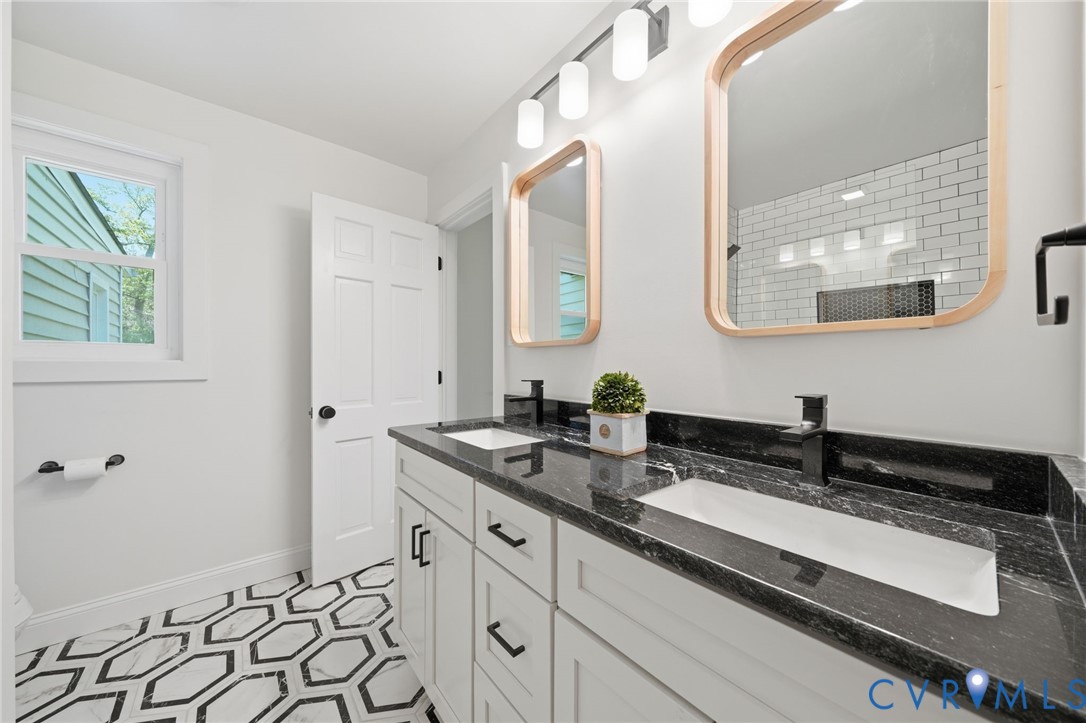1100 Hollins Road Henrico, VA 23229 - Photo 19 of 38 a bathroom with a sink and a mirror